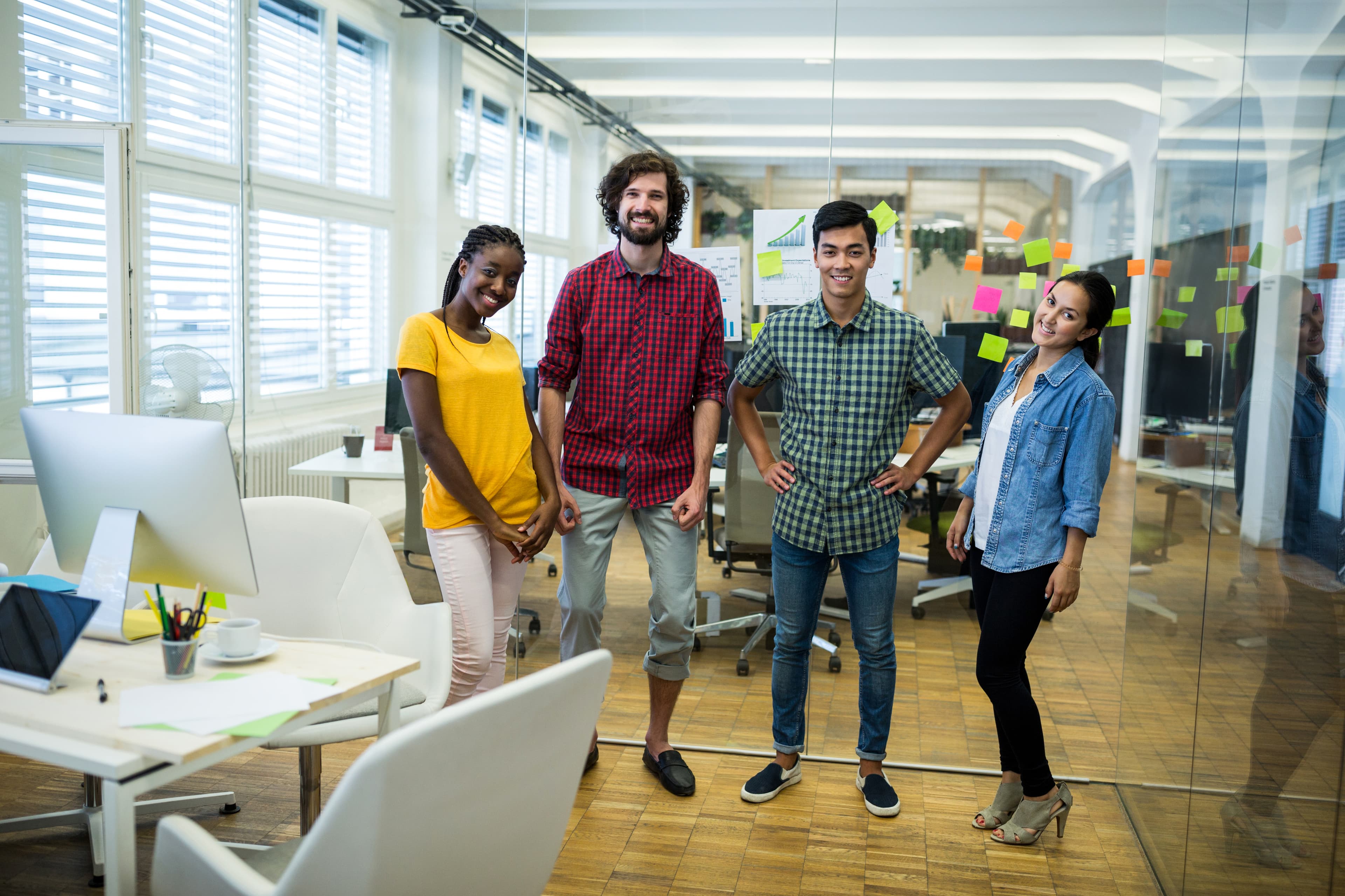 The Cozmiq team collaborating around a whiteboard during a strategy session